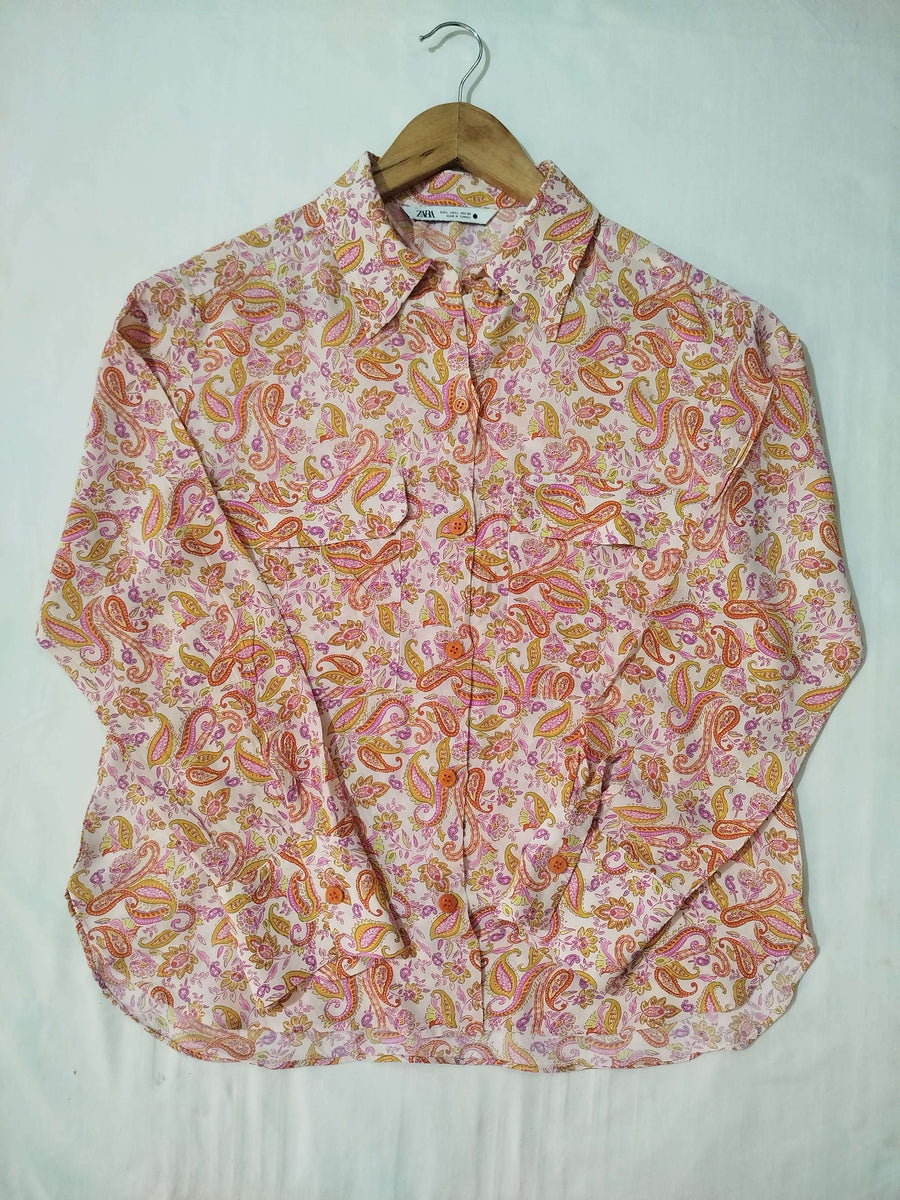 Pink patterned shirt on a white background