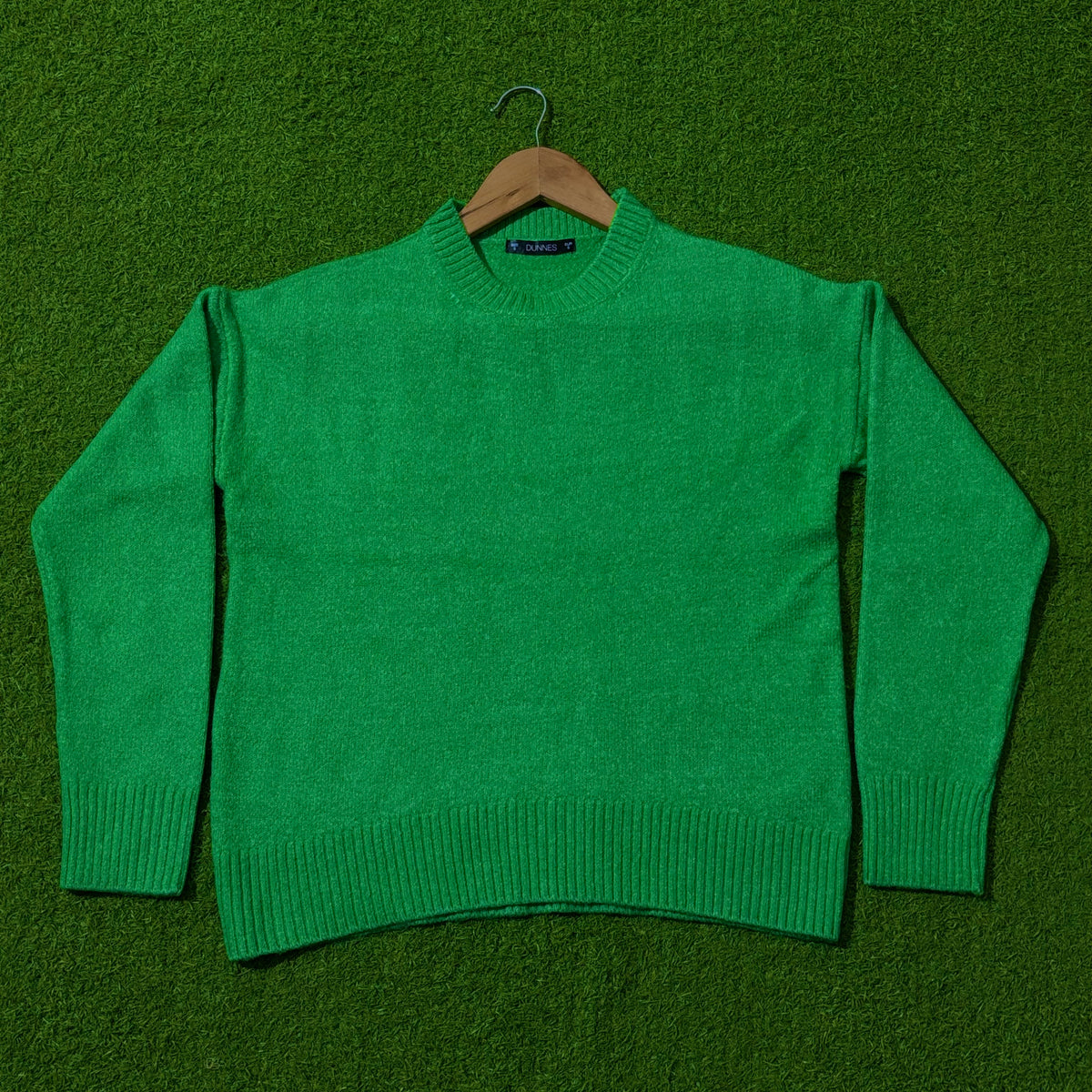Green drop-shoulder knit sweater by Dunnes Stores