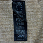 ASOS beige sweater label showing UK 8, EU 36 and US 4