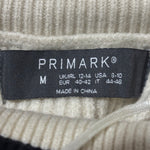 Primark cream and black sweater size M label