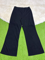 Black high-rise flared trousers laid flat