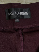 Fashion Nova label inside burgundy trousers