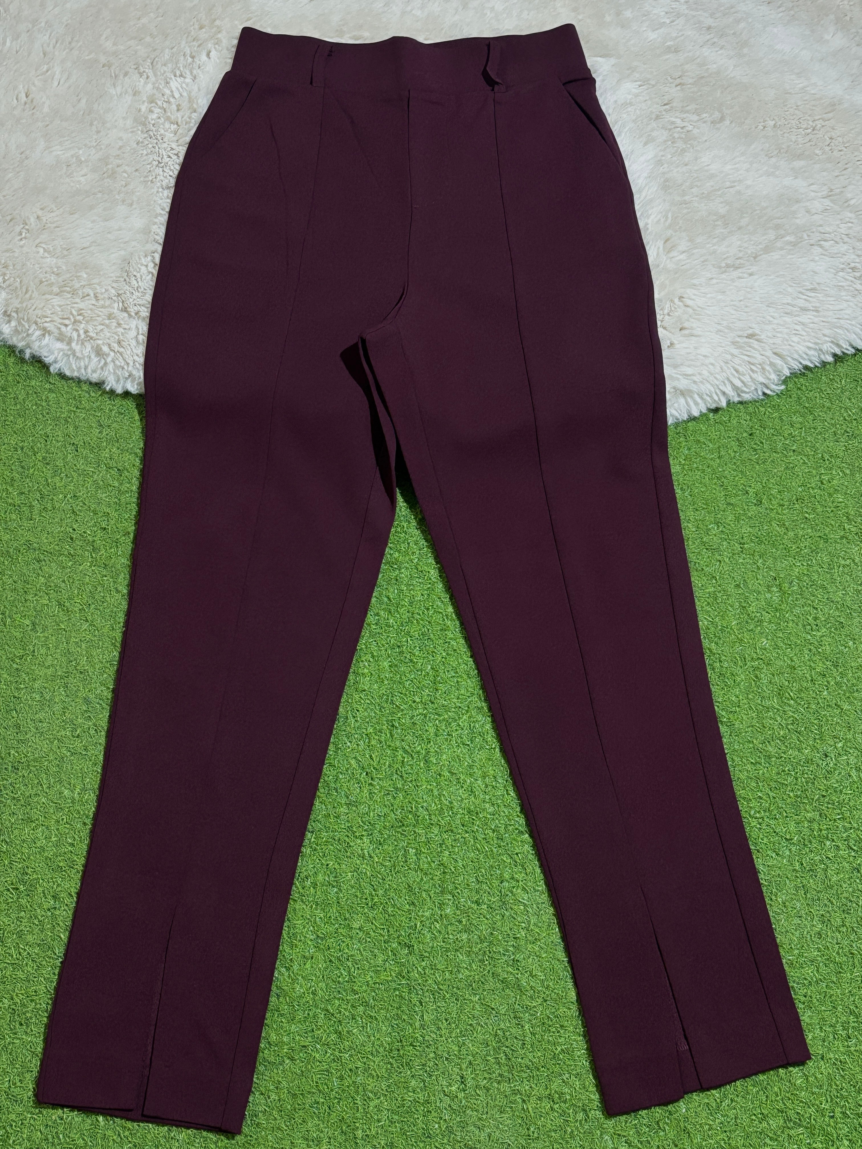 Burgundy high-rise straight-leg trousers laid flat