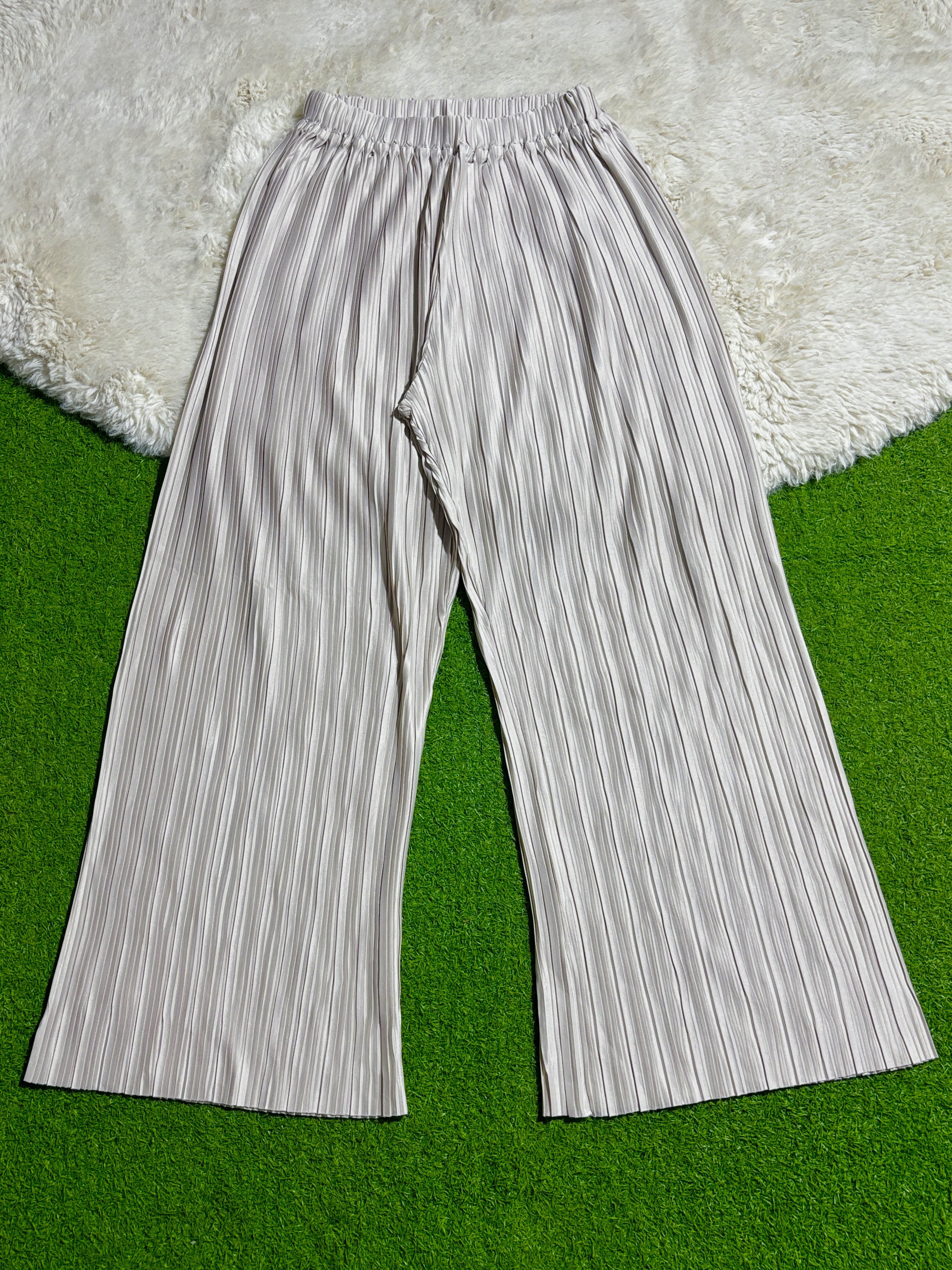 Silver pleated wide-leg trousers with gathered waistband laid flat