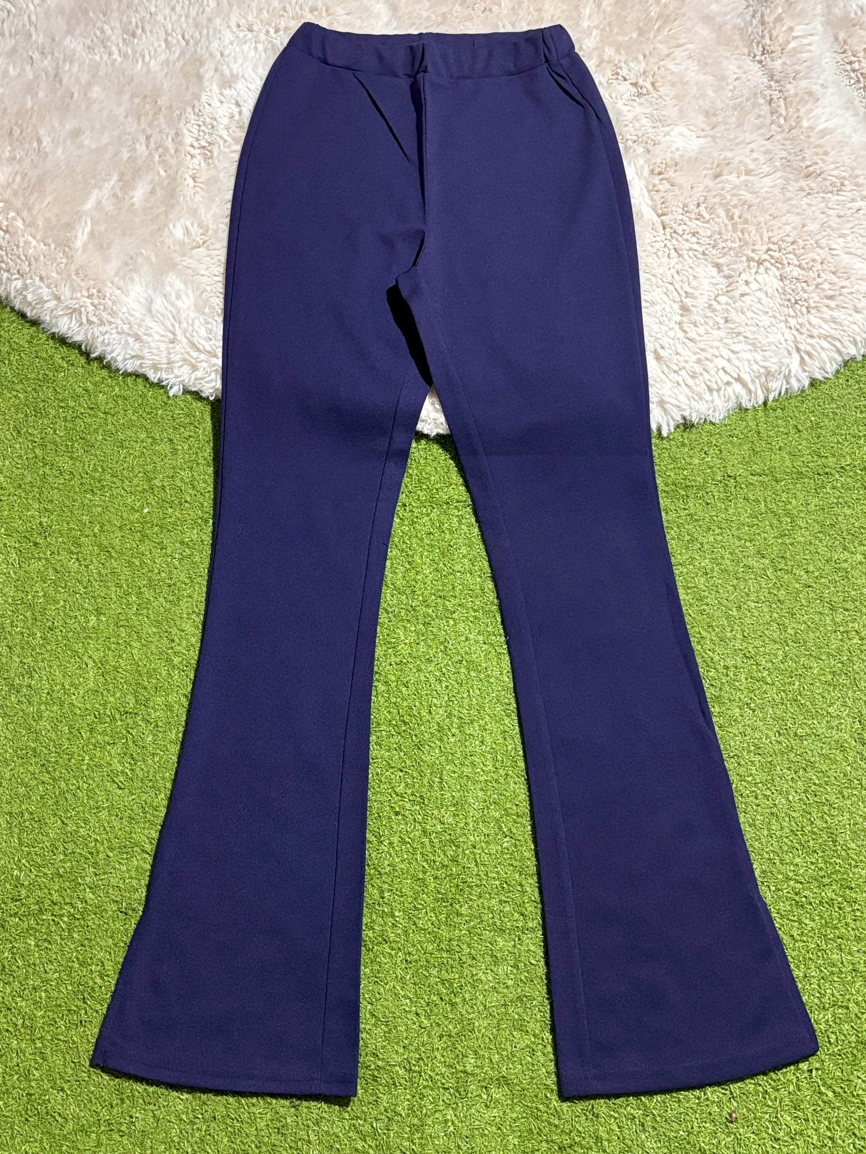 Navy blue high-rise flared trousers laid flat