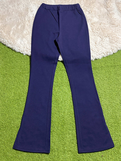 Navy blue high-rise flared trousers laid flat