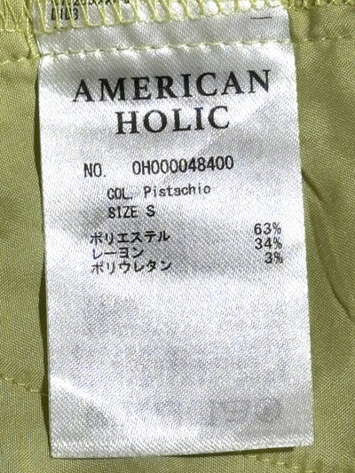 American Holic label showing pistachio color, size S and fabric composition - alternate view