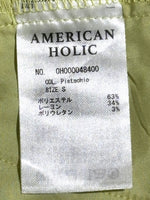 American Holic label showing pistachio color, size S and fabric composition