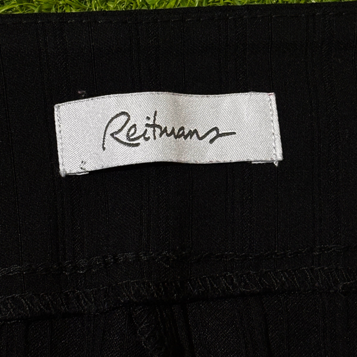 Back view of black straight-leg pants