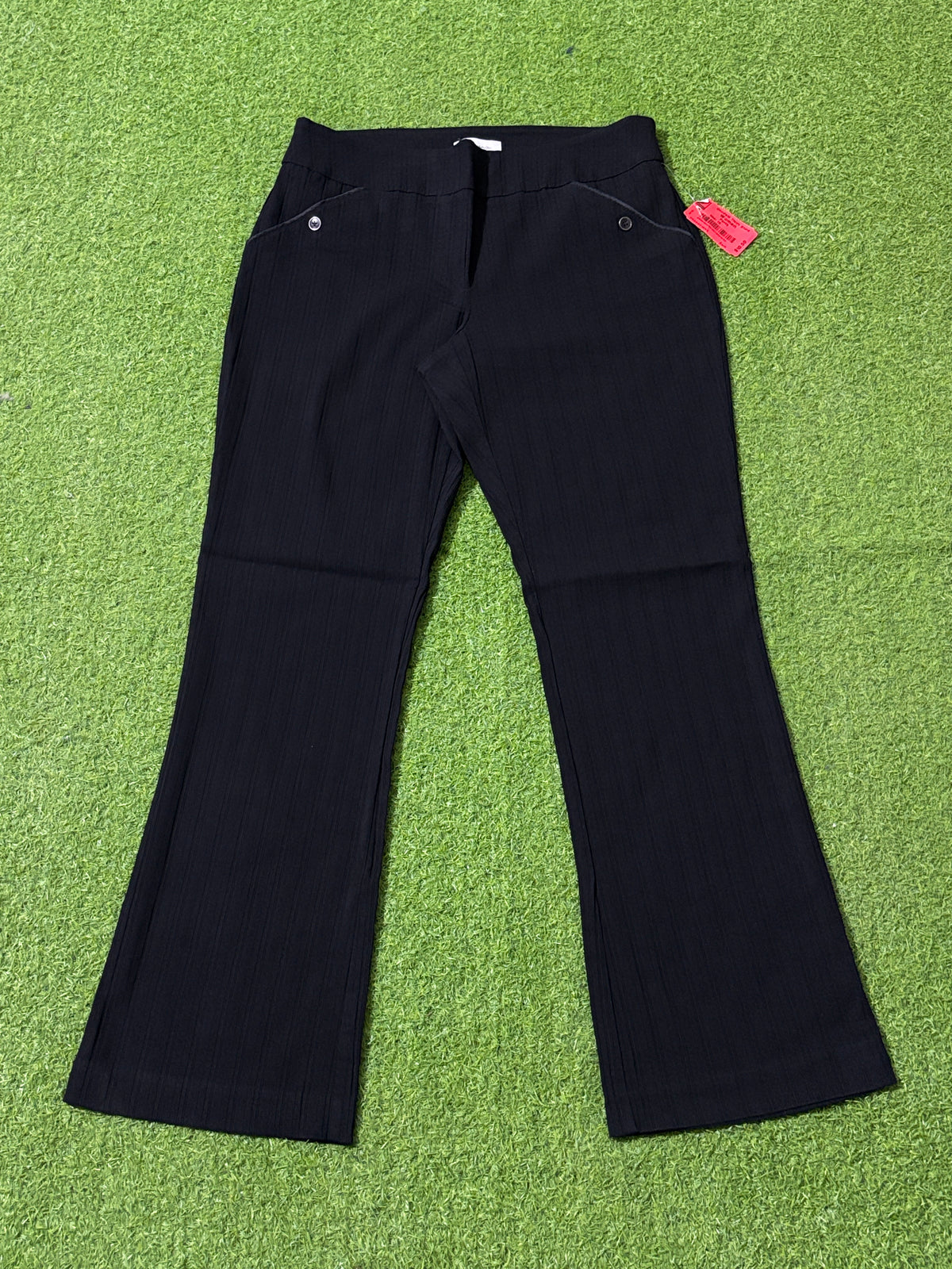 Black straight-leg pants with button-accented pocket details, front view