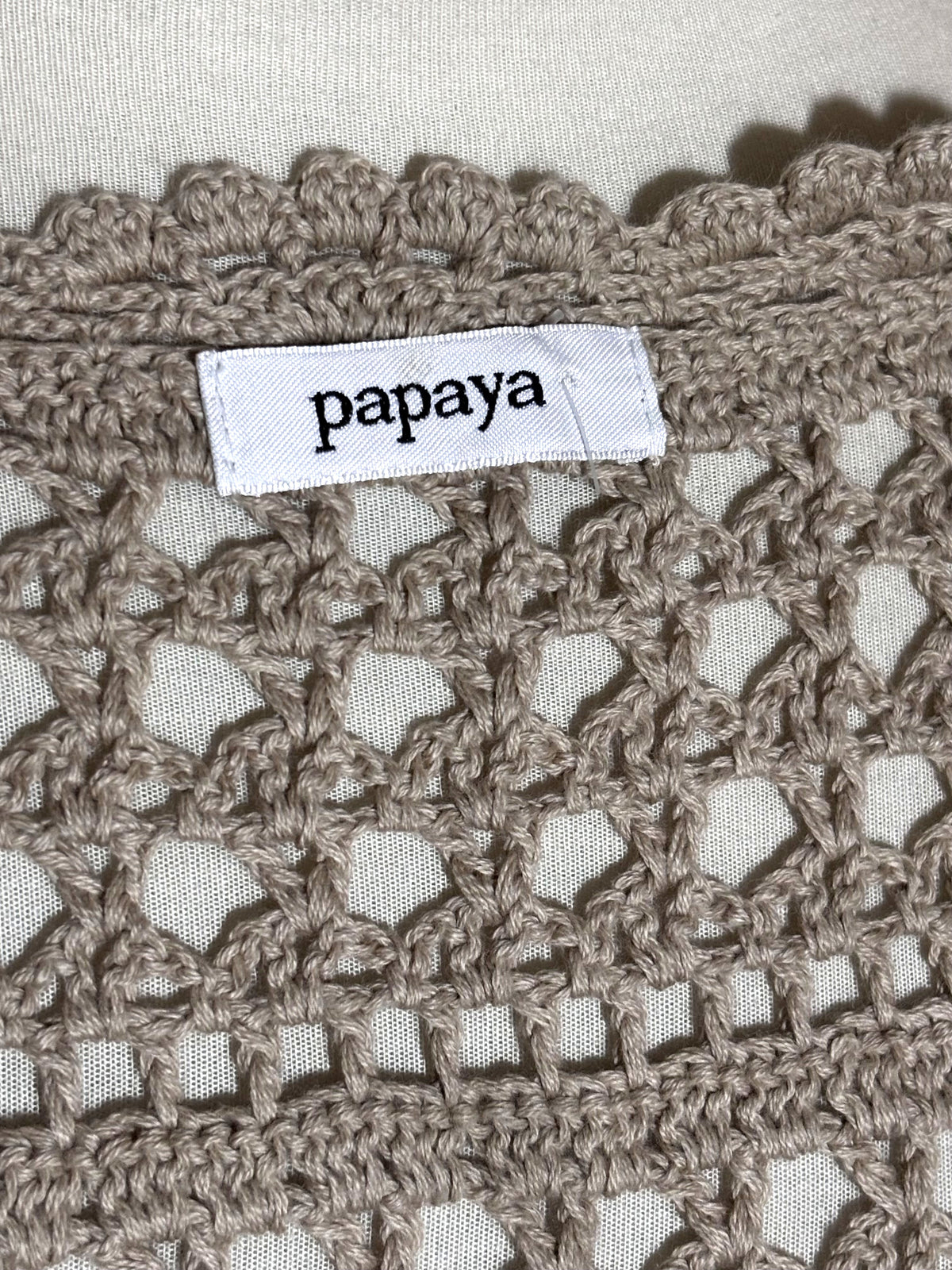 Papaya label on taupe openwork vest