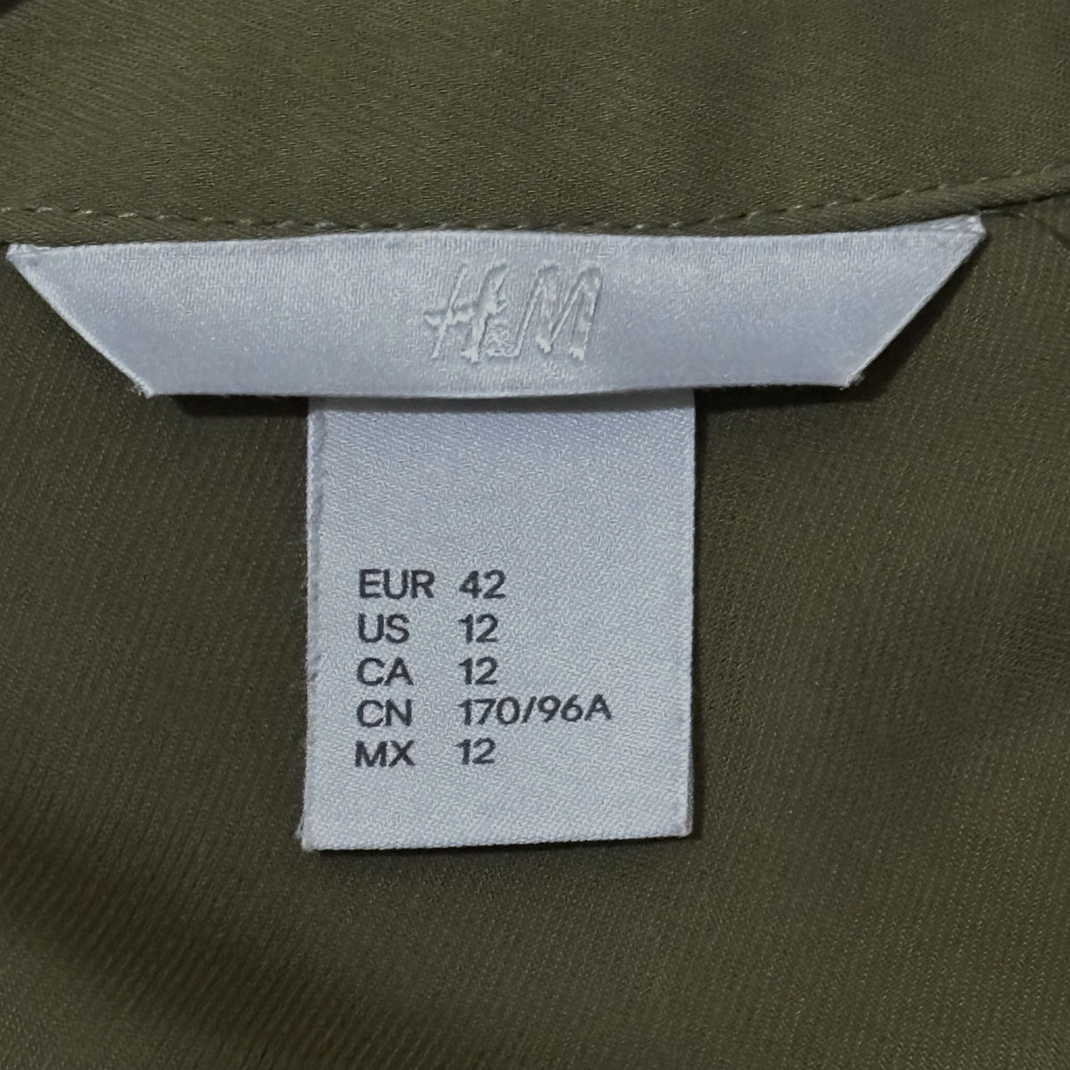 H&M label showing US 12 and EUR 42