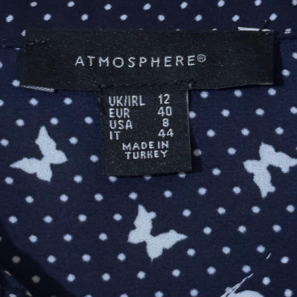 Atmosphere label showing UK/IRL 12 EUR 40 USA 8 IT 44