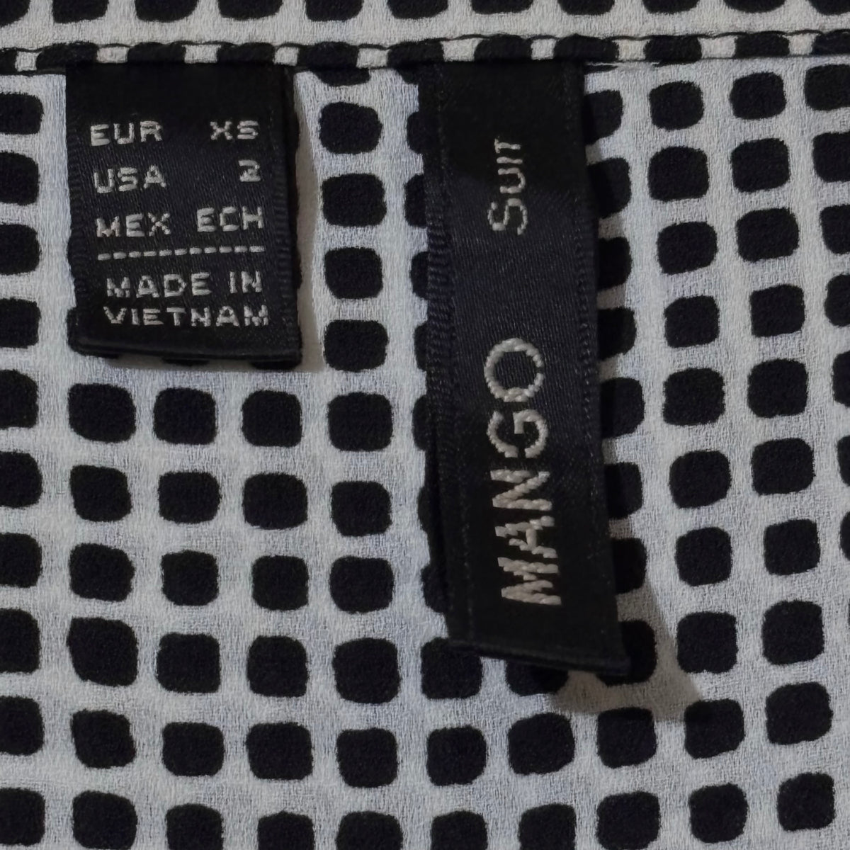 Mango Suit brand label showing EUR size XS