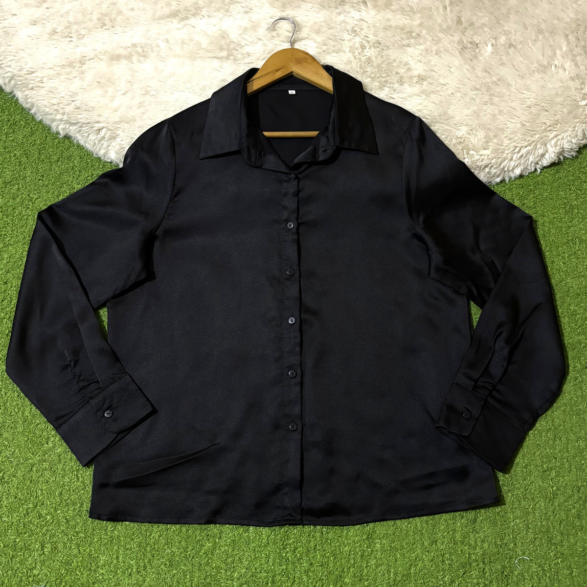 Black classic collared button-down shirt with long button-cuff sleeves