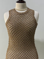 Gold openwork pattern and round neckline close-up