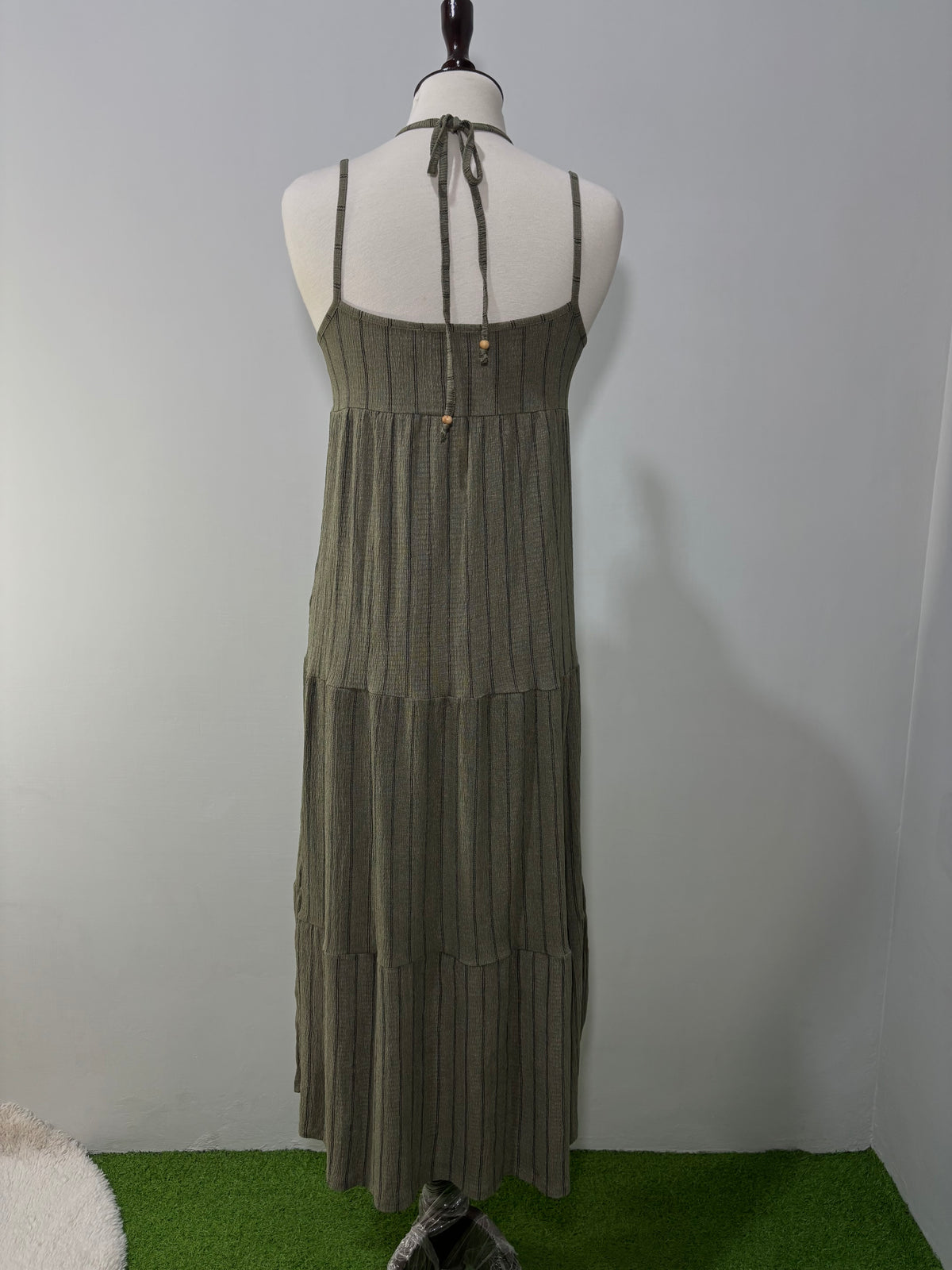 Back view of olive green tiered maxi dress with beaded halter ties