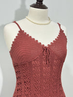 Scalloped V-neckline and tie-front detail on dusty rose dress