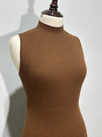 Angled shoulder detailing on brown ribbed dress