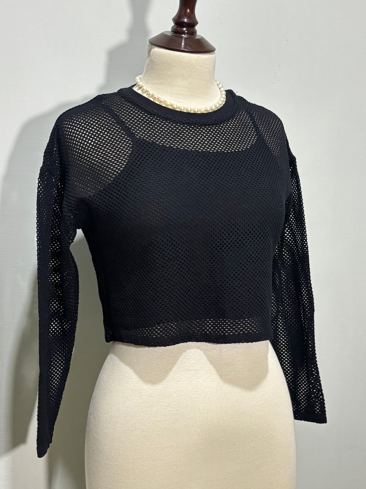 Black crop top openwork detailing and dropped shoulders
