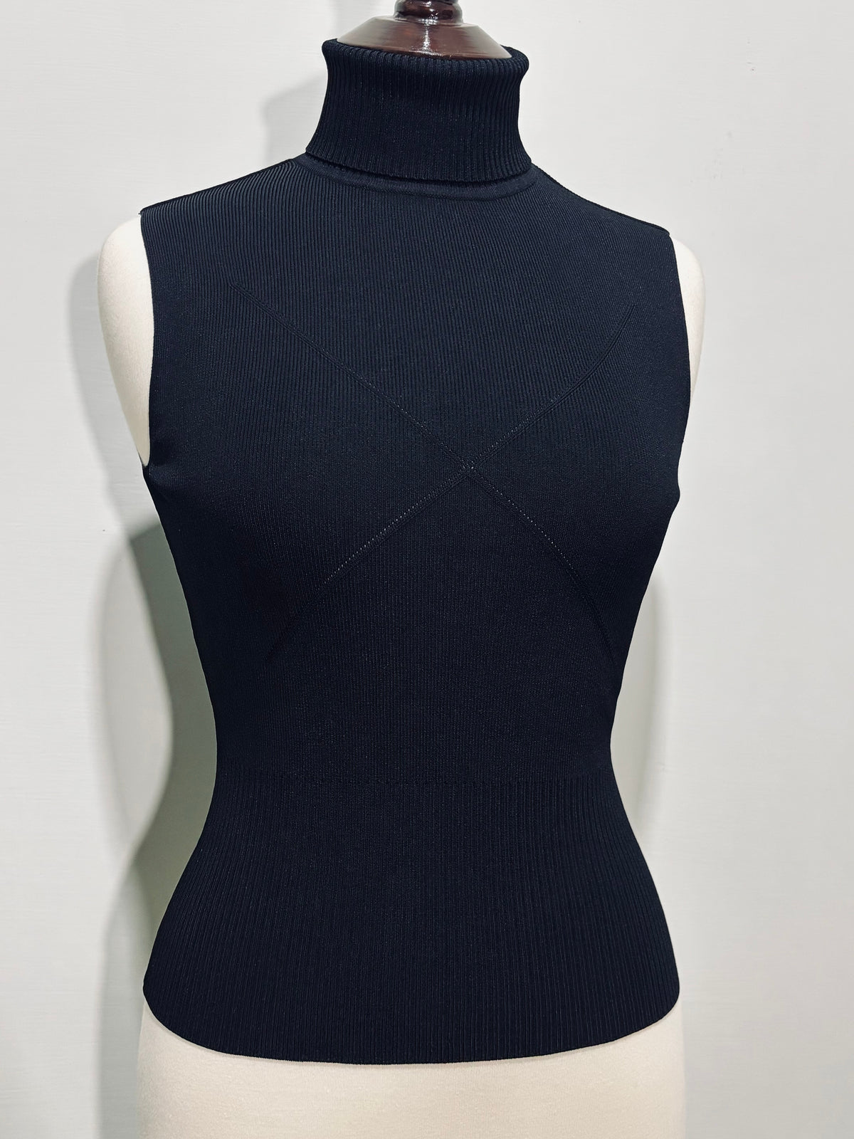 Black fitted sleeveless turtleneck top front view