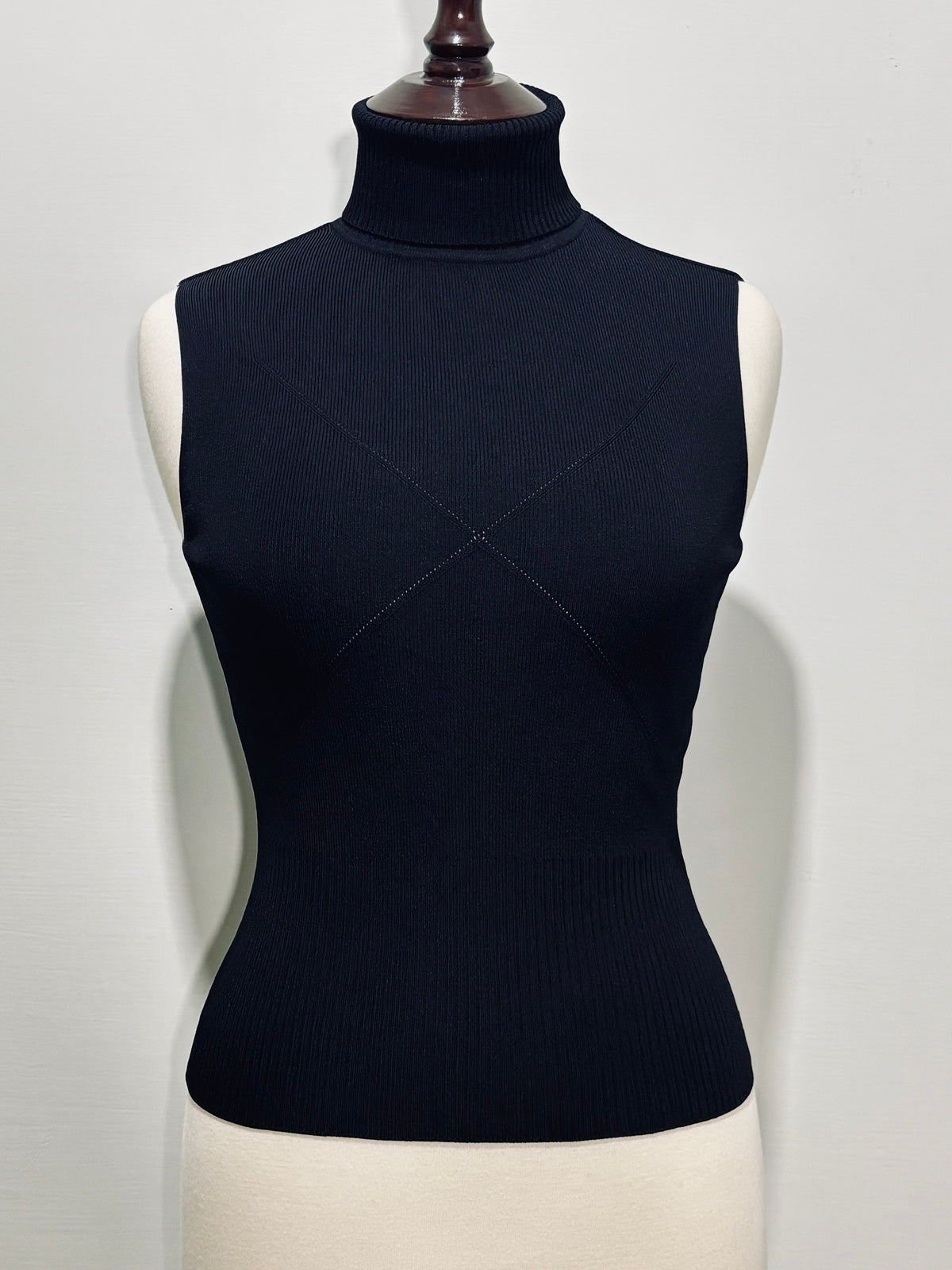 Black turtleneck top subtle geometric detailing