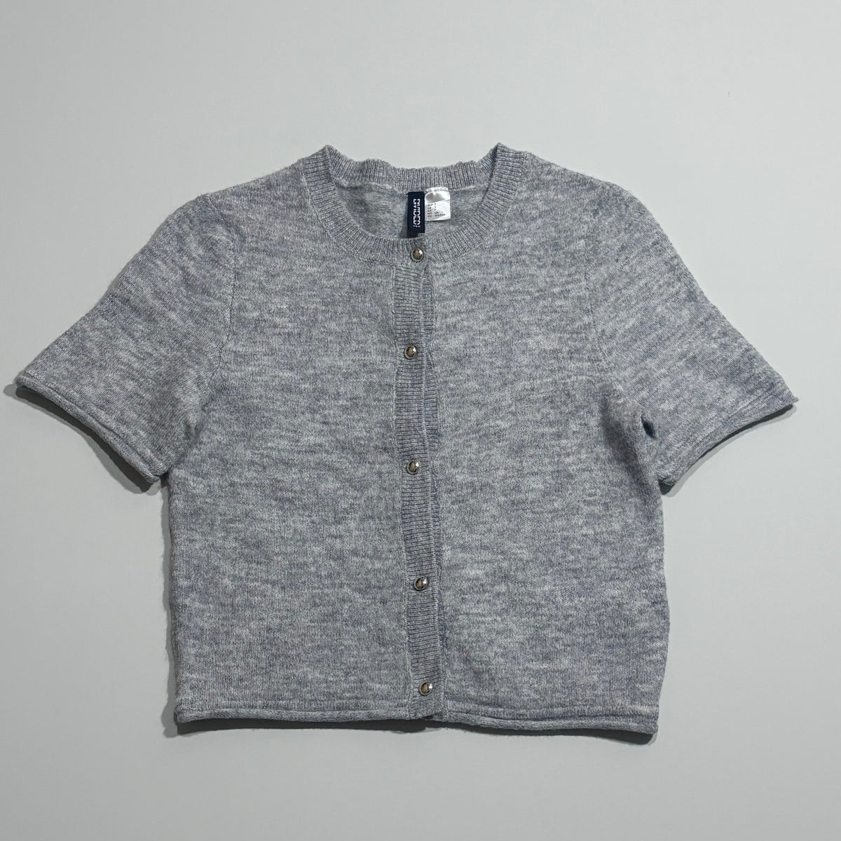 Light grey short-sleeve cropped cardigan with button front