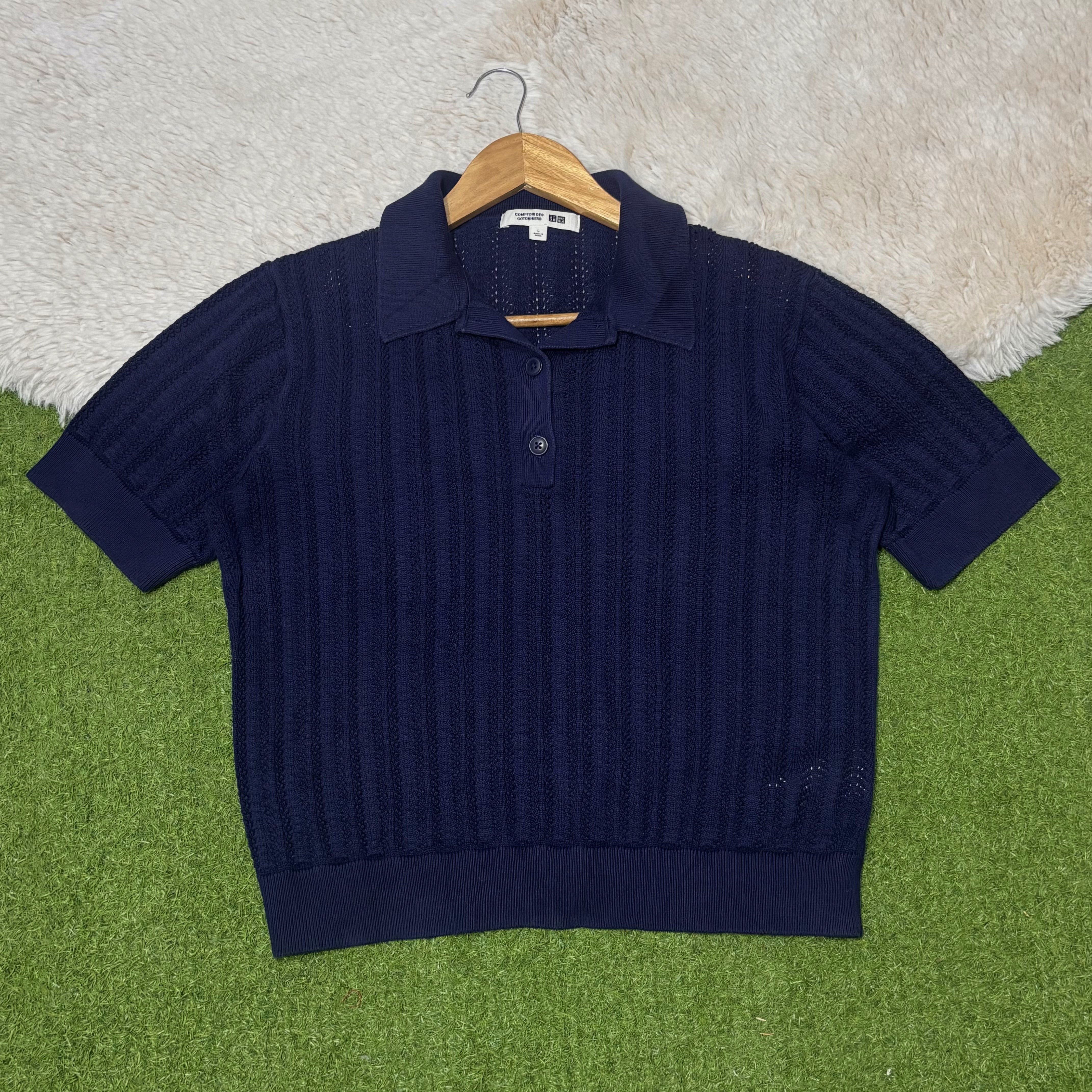 Navy blue short-sleeve pointelle polo top with button placket