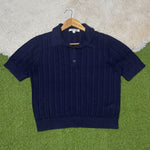 Navy blue short-sleeve pointelle polo top with button placket