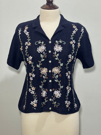Navy blue short-sleeve blouse with floral embroidery and button front