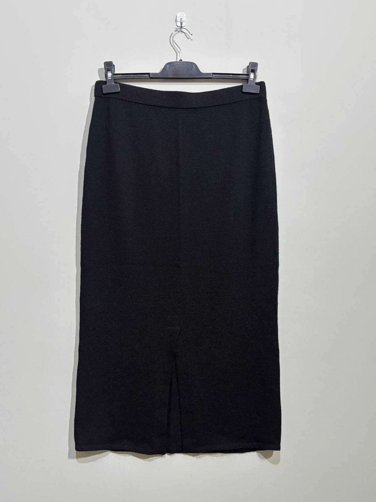 Black straight midi skirt back view with slit