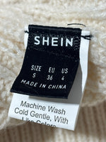 SHEIN skirt label showing size S EU 36 US 4