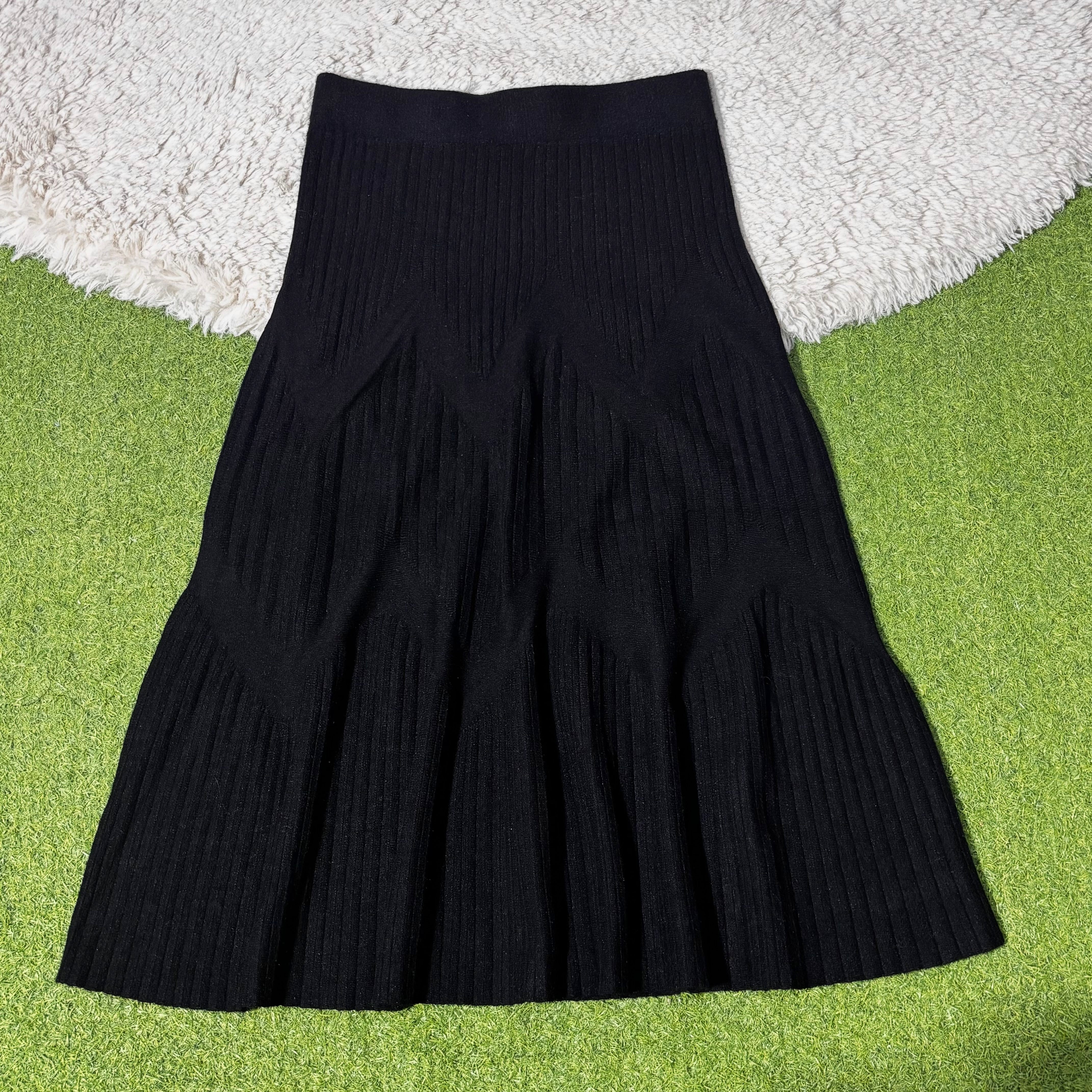 Black ribbed flared winter midi skirt with angled panel detail