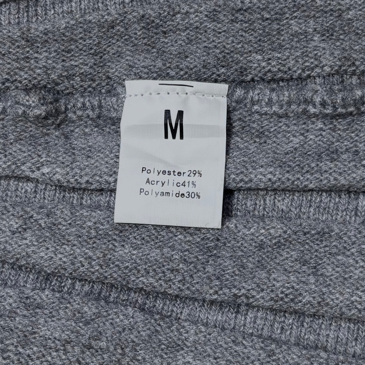 Skirt label showing size M and fabric composition