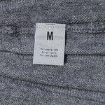 Skirt label showing size M and fabric composition
