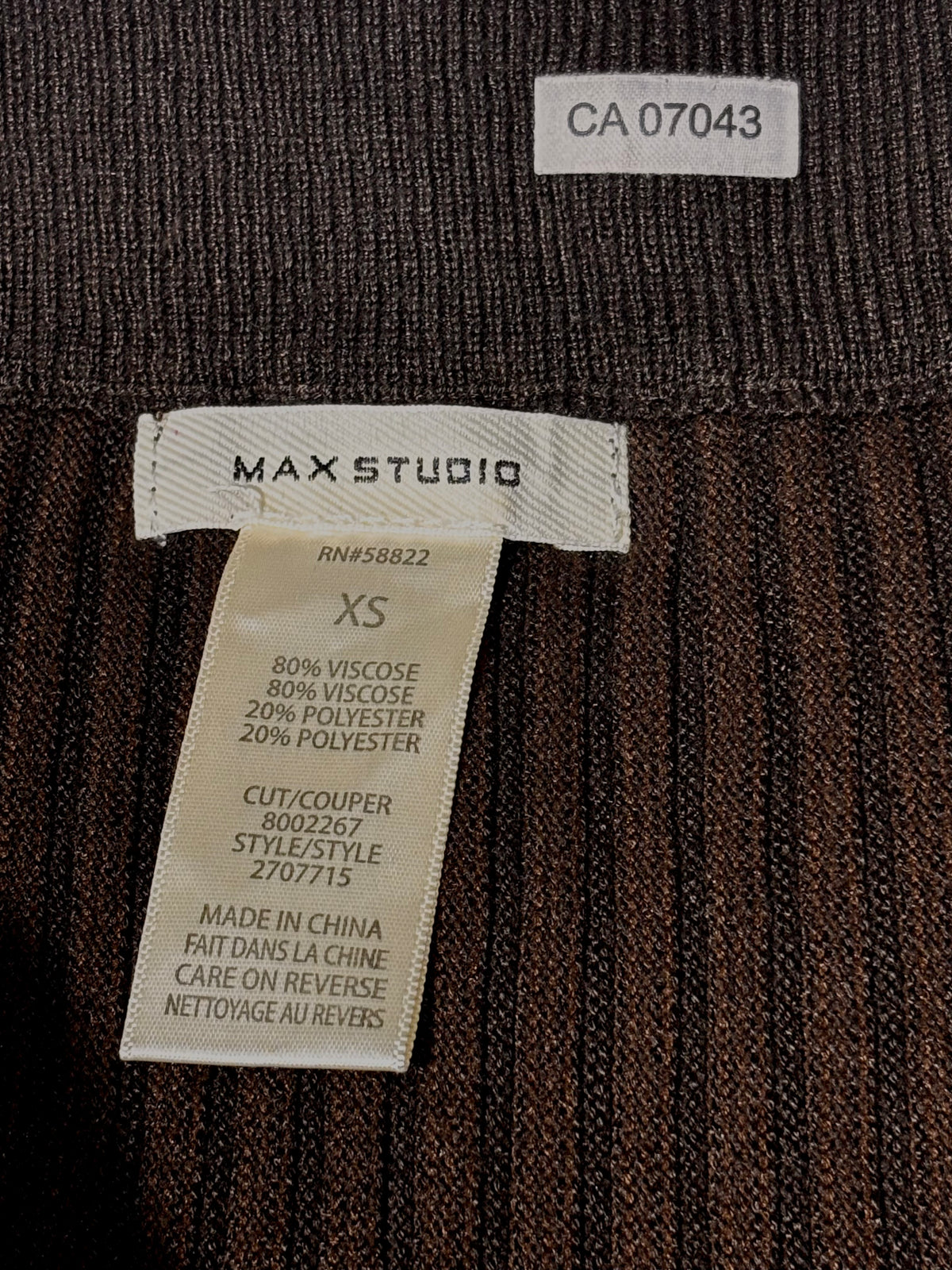 MAX STUDIO skirt label showing size XS and fabric composition