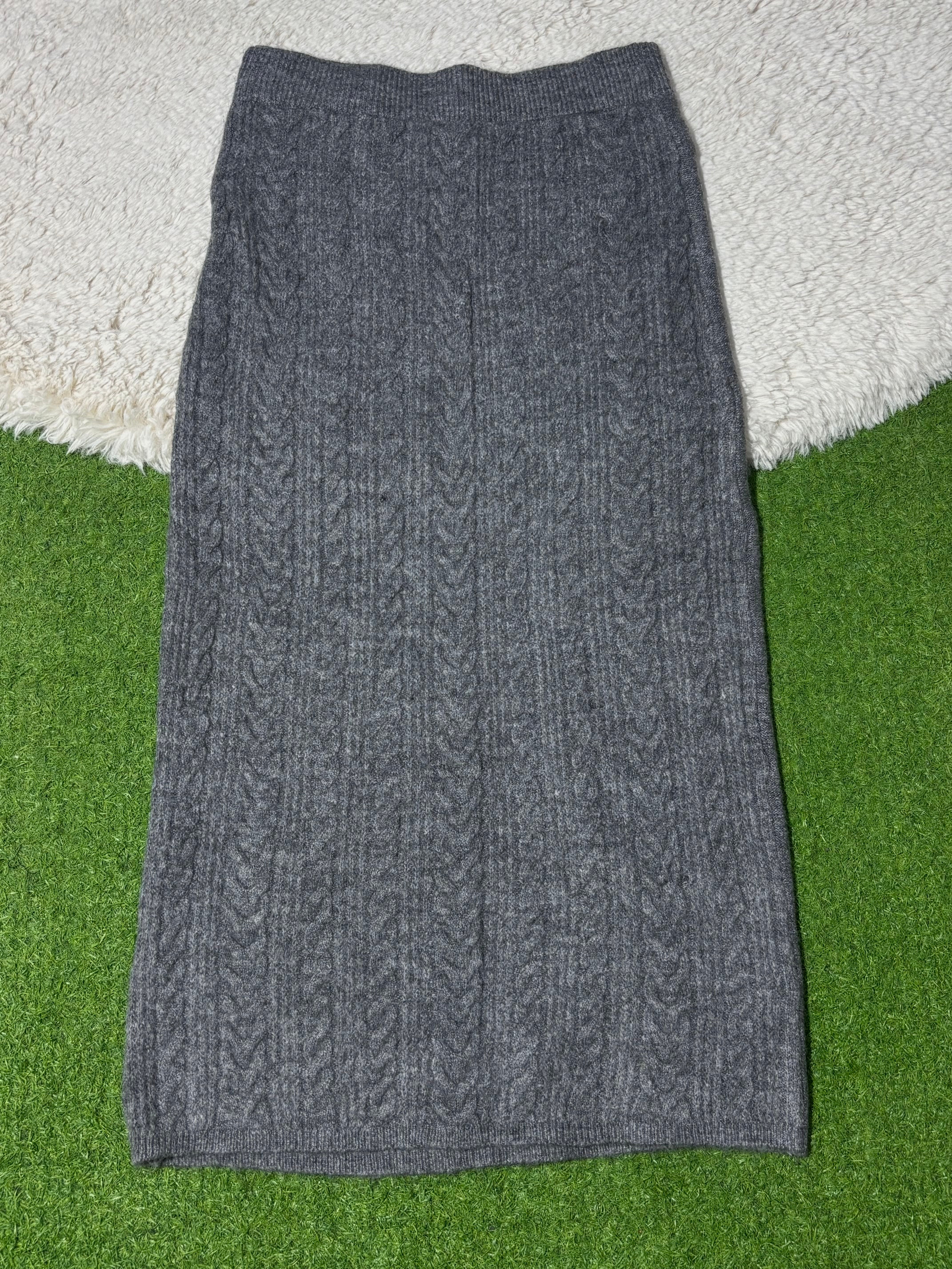 Grey cable-knit winter midi skirt laid flat