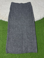 Grey cable-knit winter midi skirt laid flat