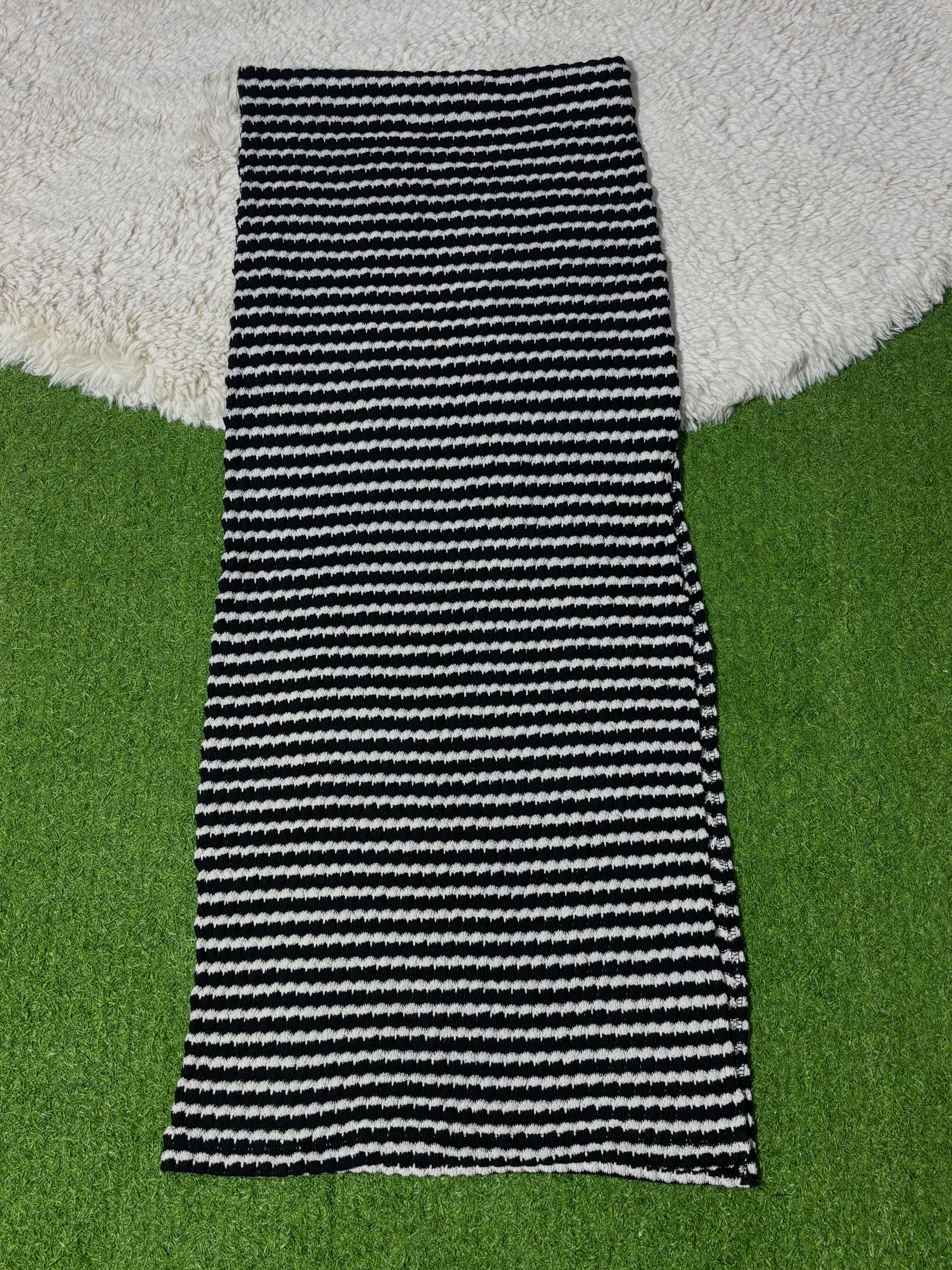 Black and white striped winter midi skirt laid flat