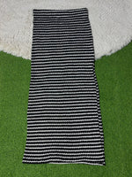Black and white striped winter midi skirt laid flat