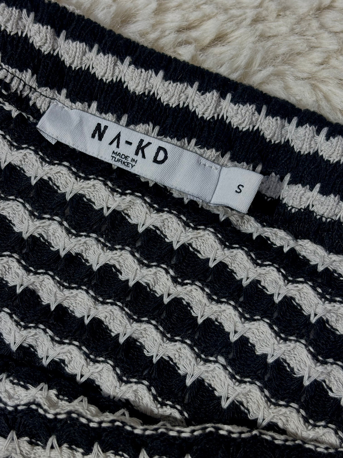 NA-KD skirt label showing size S