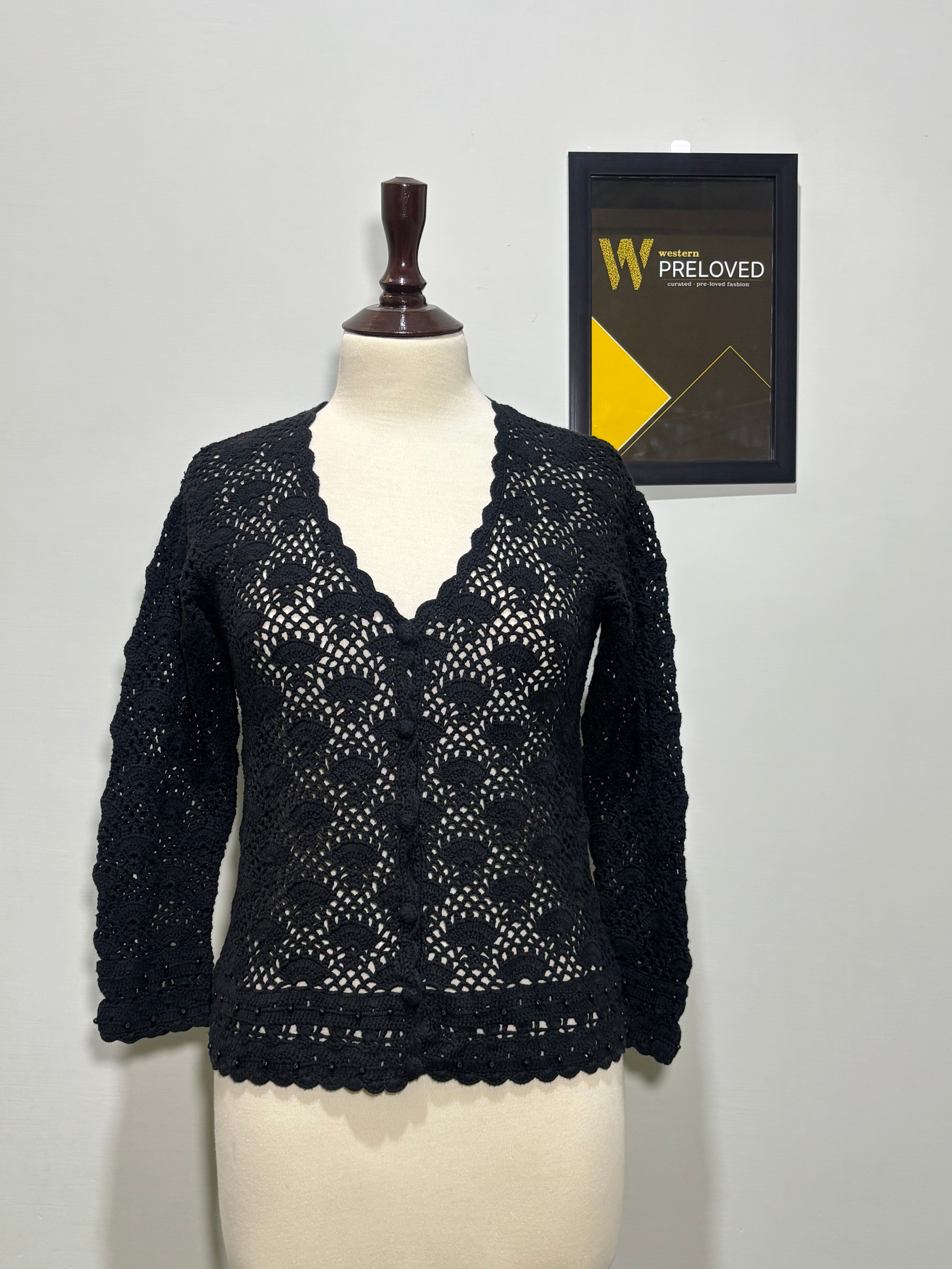 Black floral openwork V-neck button-front top with scalloped edges