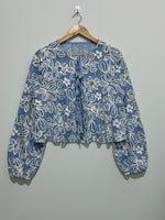 Blue and white floral openwork tie-front long-sleeve top