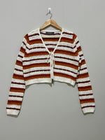 Striped openwork long-sleeve tie-front top on hanger