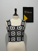 Black and white floral openwork square-neck crop top on mannequin