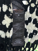 F&F label showing size M and 100% Acrylic
