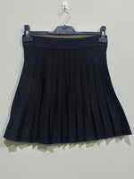 Black pleated A-line mini skirt with wide ribbed waistband