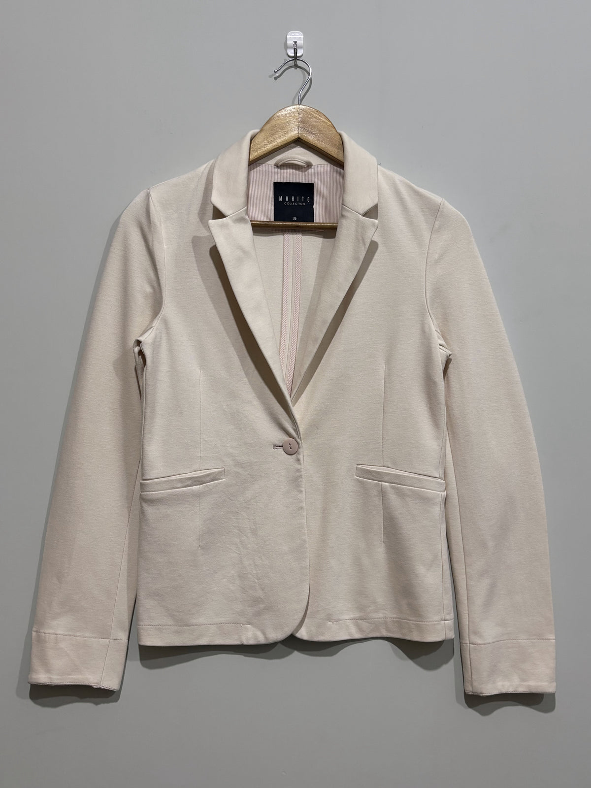 Cream fitted long-sleeve blazer front view