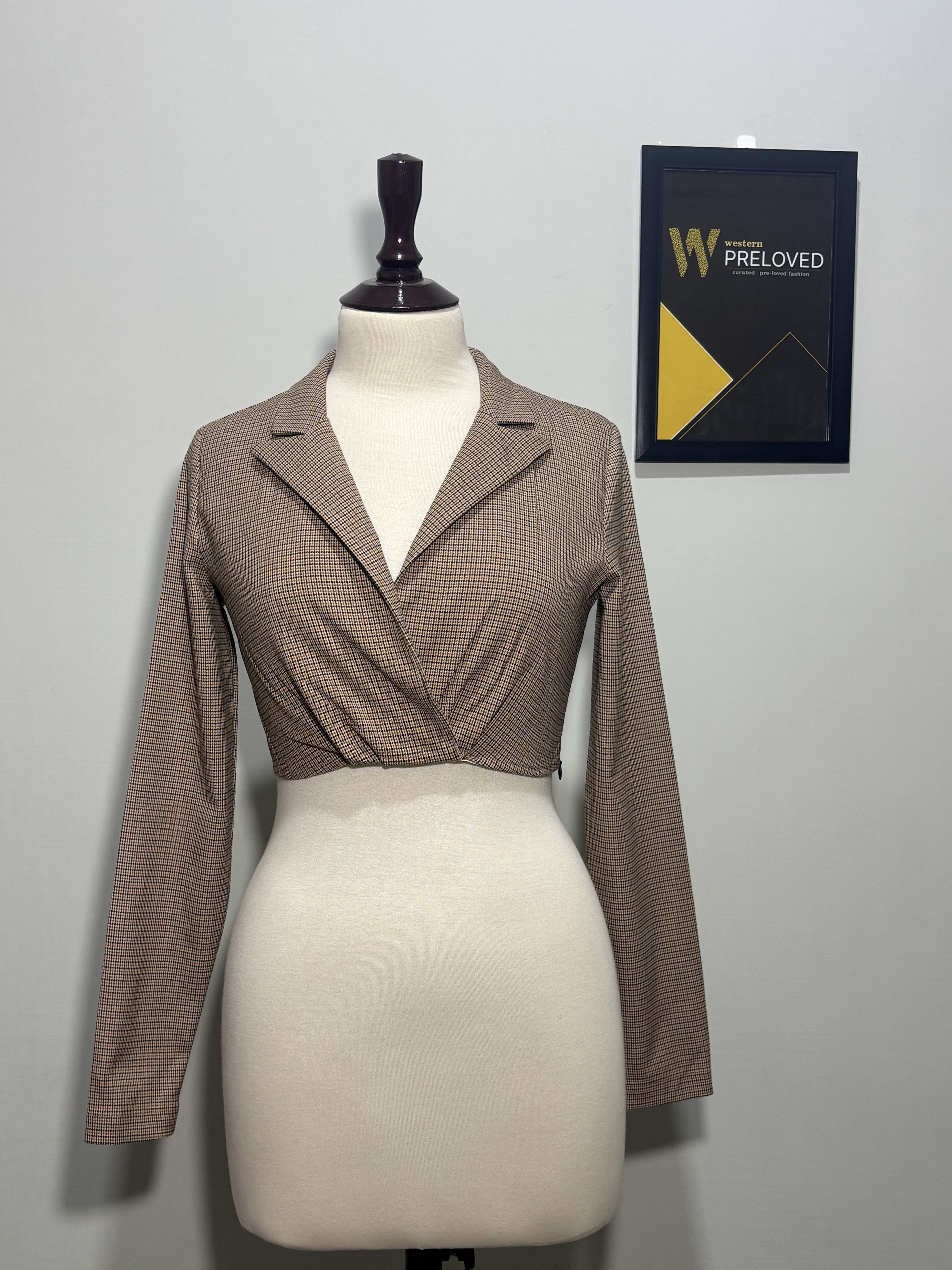 Brown and black checked lapel wrap-style crop top front view