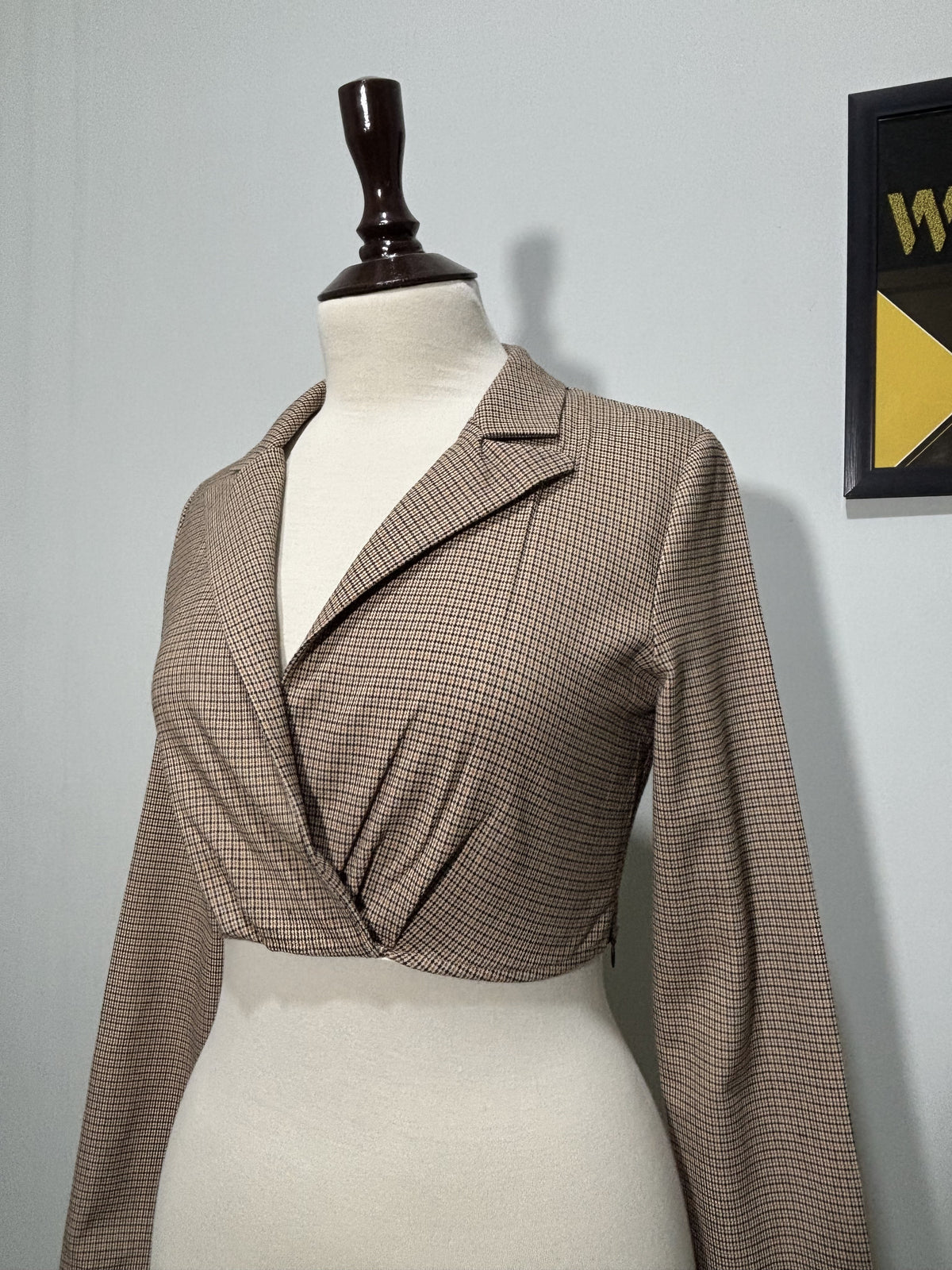 Checked cropped top with notched lapels and long sleeves side view